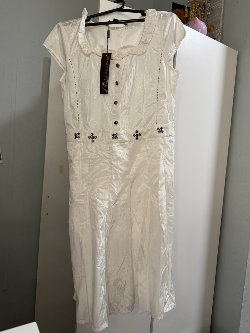 Elegant White Cap-Sleeve Dress with Decorative Buttons